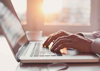 Man on laptop website