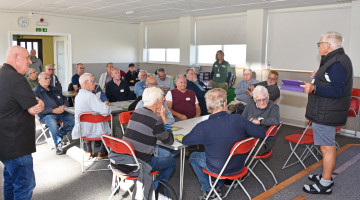 Attends at men's shed 