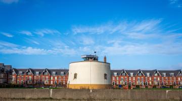 Blue skies with a round building