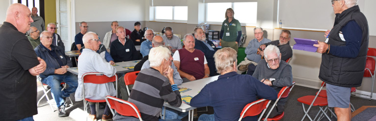 Attends at men's shed 