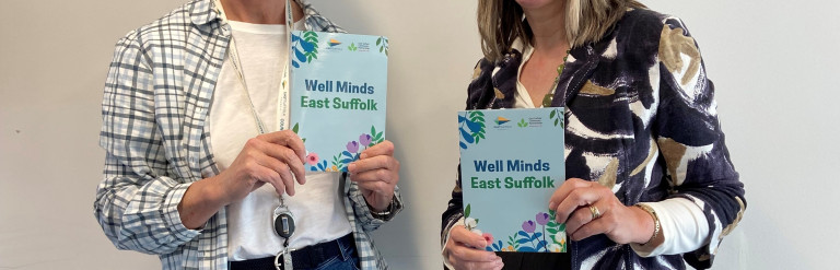 Cllrs holding a booklet that reads 'Well Minds'
