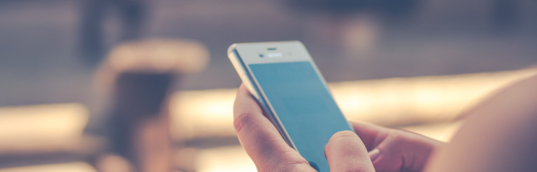 person using smartphone outside